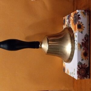 Brass bell with black handle
